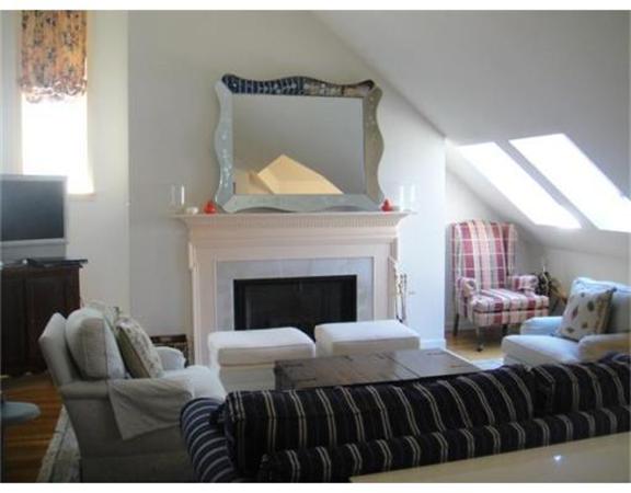 63 Garden Road, Unit G8 Wellesley, MA 02481 - Photo 4 of 12 a bedroom with a bed and a fireplace