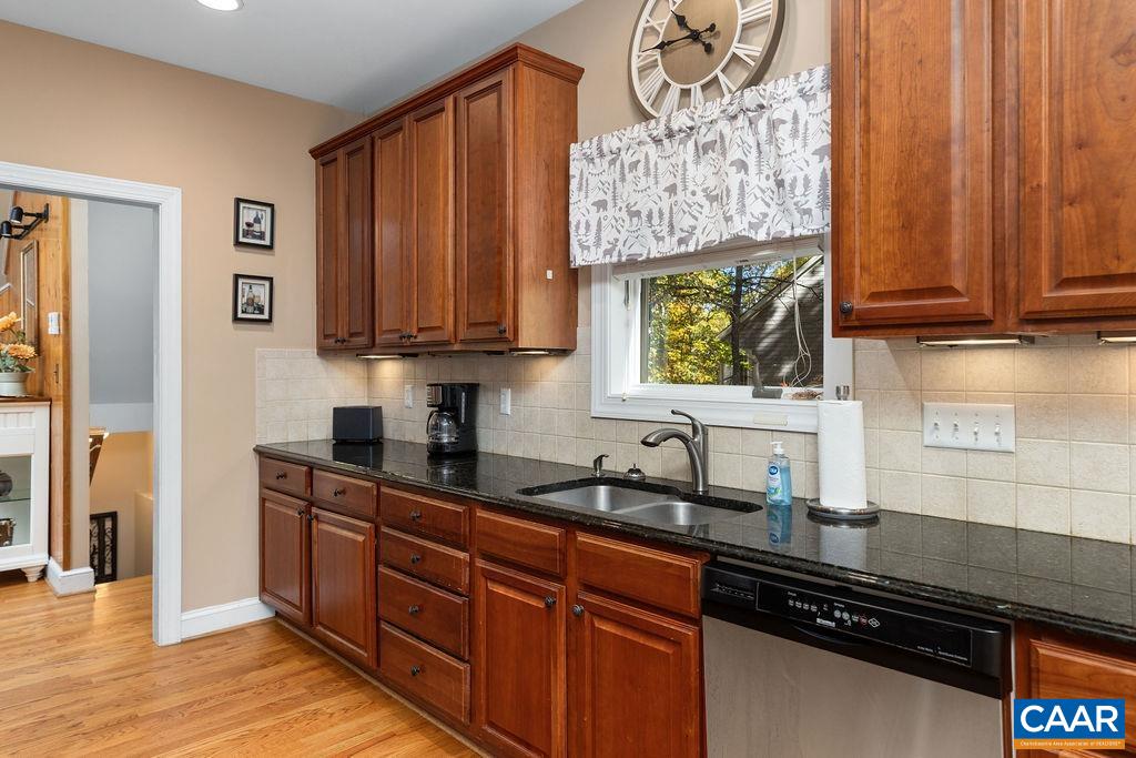 59 Timber Ridge Lane Roseland, VA 22967 - Photo 11 of 45 a kitchen with stainless steel appliances wooden cabinets and a sink