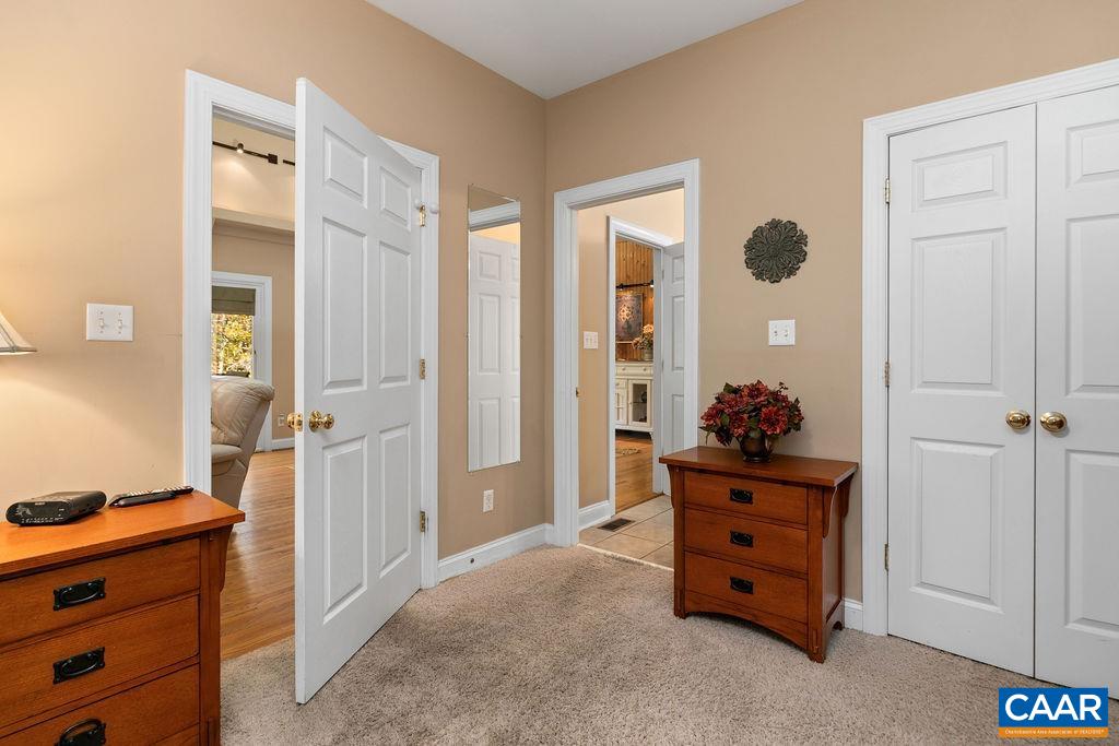 59 Timber Ridge Lane Roseland, VA 22967 - Photo 16 of 45 a room with a dresser and a mirror