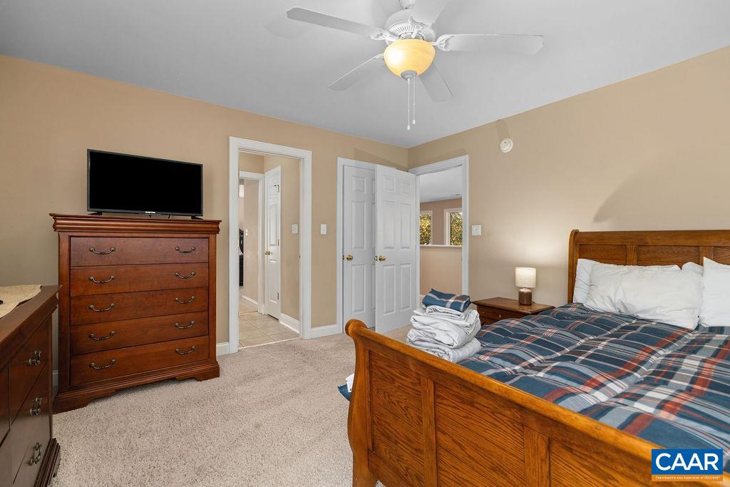 59 Timber Ridge Lane Roseland, VA 22967 - Photo 25 of 45 a bedroom with a bed and flat screen tv