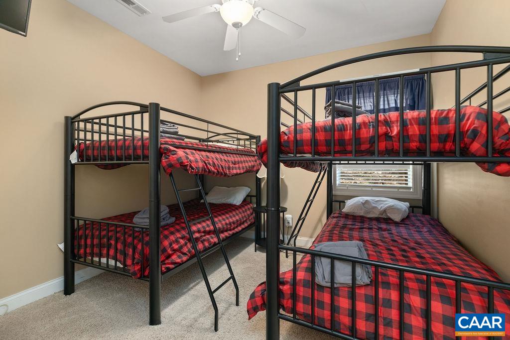 59 Timber Ridge Lane Roseland, VA 22967 - Photo 31 of 45 a bedroom with furniture and a chandelier