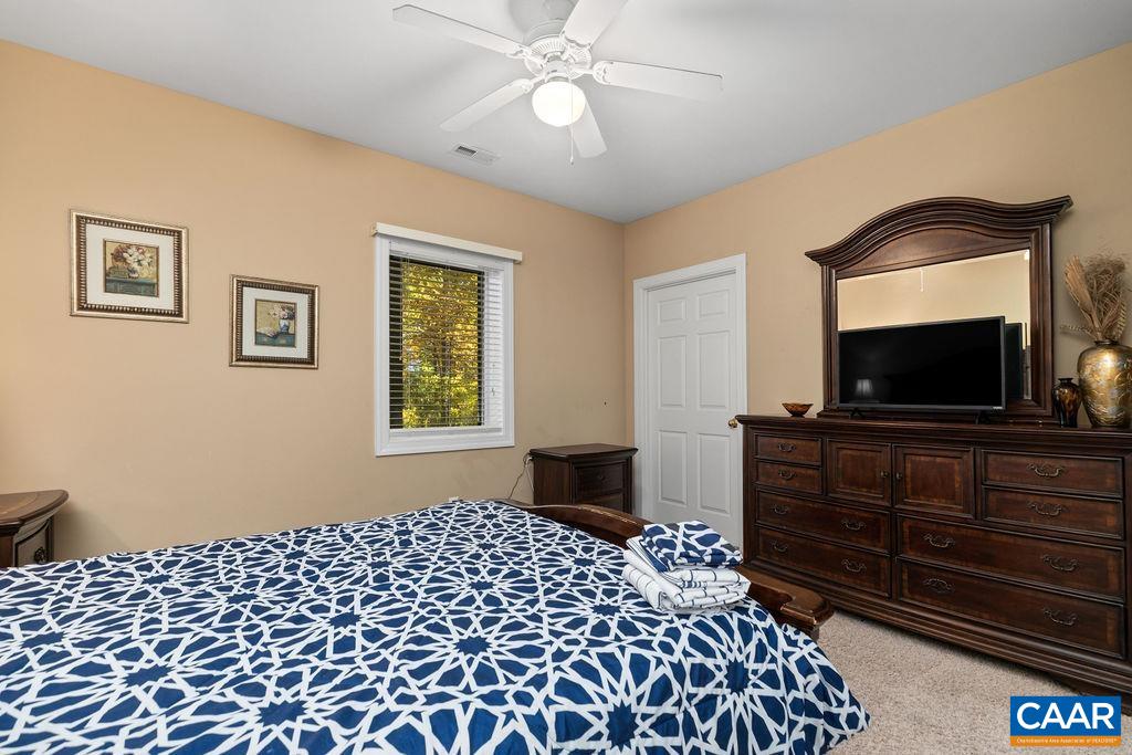 59 Timber Ridge Lane Roseland, VA 22967 - Photo 34 of 45 a bedroom with a bed and a flat screen tv