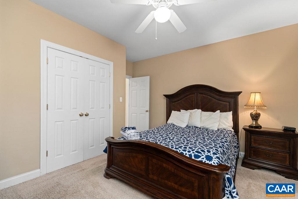 59 Timber Ridge Lane Roseland, VA 22967 - Photo 35 of 45 a bedroom with a bed and a lamp on dresser
