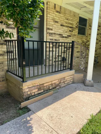 a view of a balcony with wooden floor
