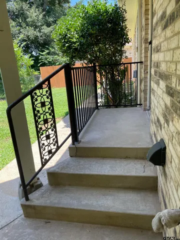 a view of a bench in the porch