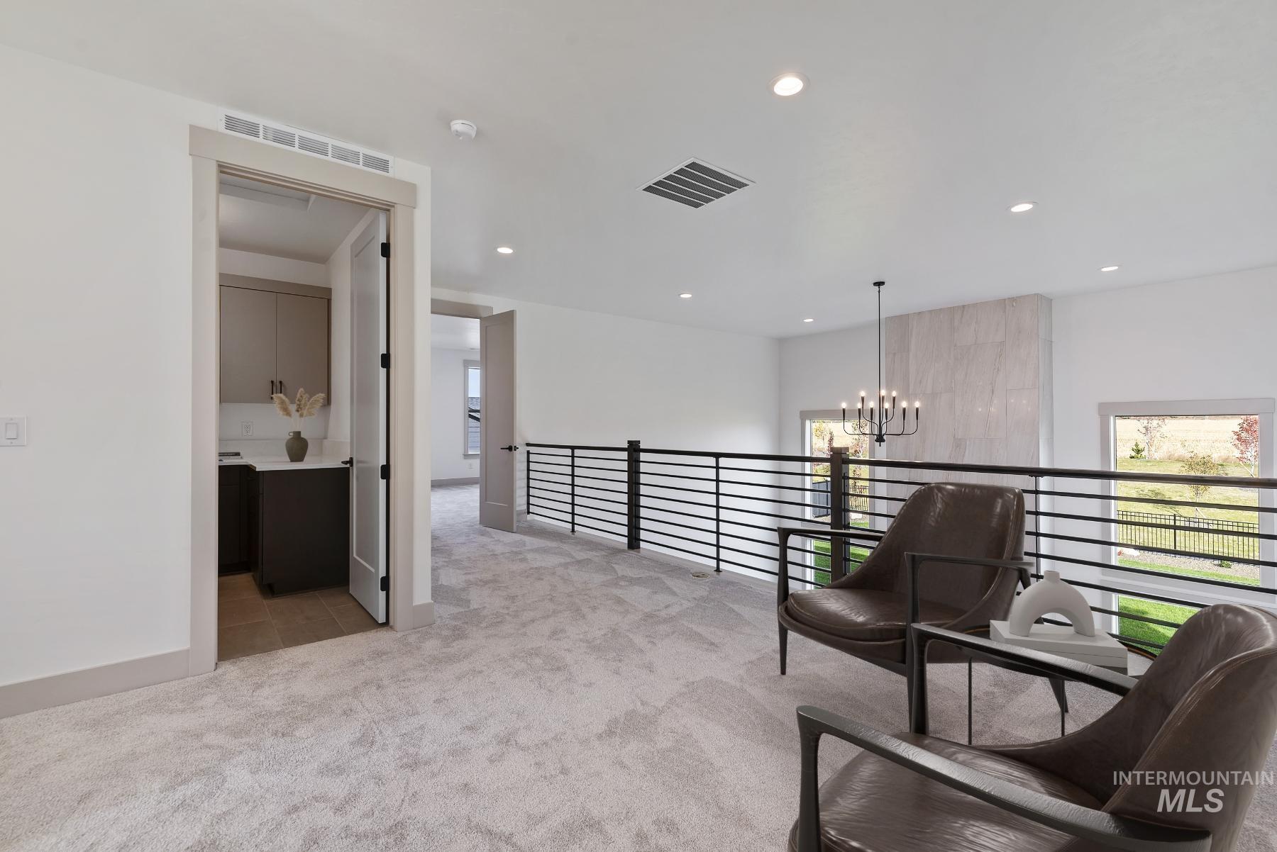 8482 West Graye Street, Unit ALPINE Meridian, ID 83646 - Photo 11 of 19 Living area with light colored carpet, a chandelier, and recessed lighting