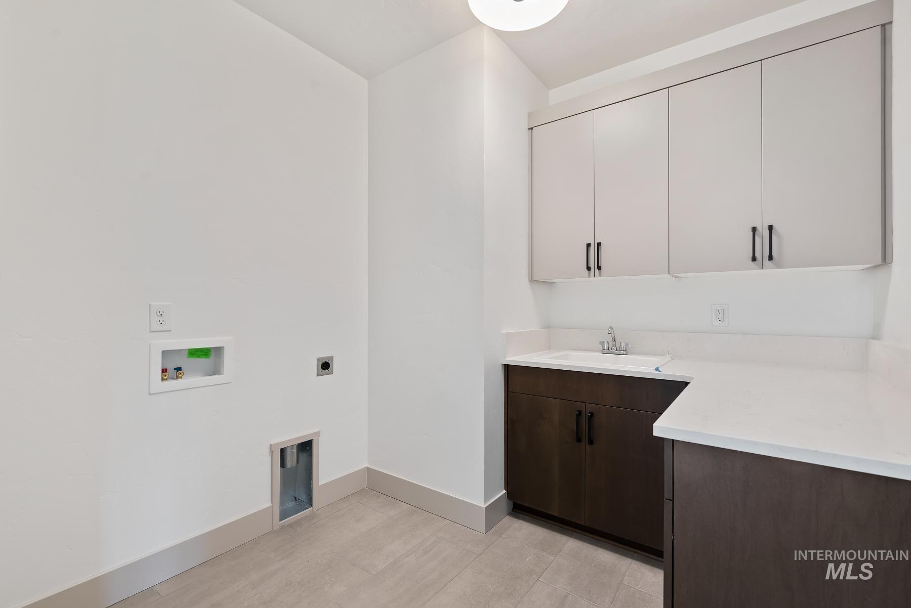 8482 West Graye Street, Unit ALPINE Meridian, ID 83646 - Photo 18 of 19 Washroom featuring electric dryer hookup, washer hookup, and cabinet space