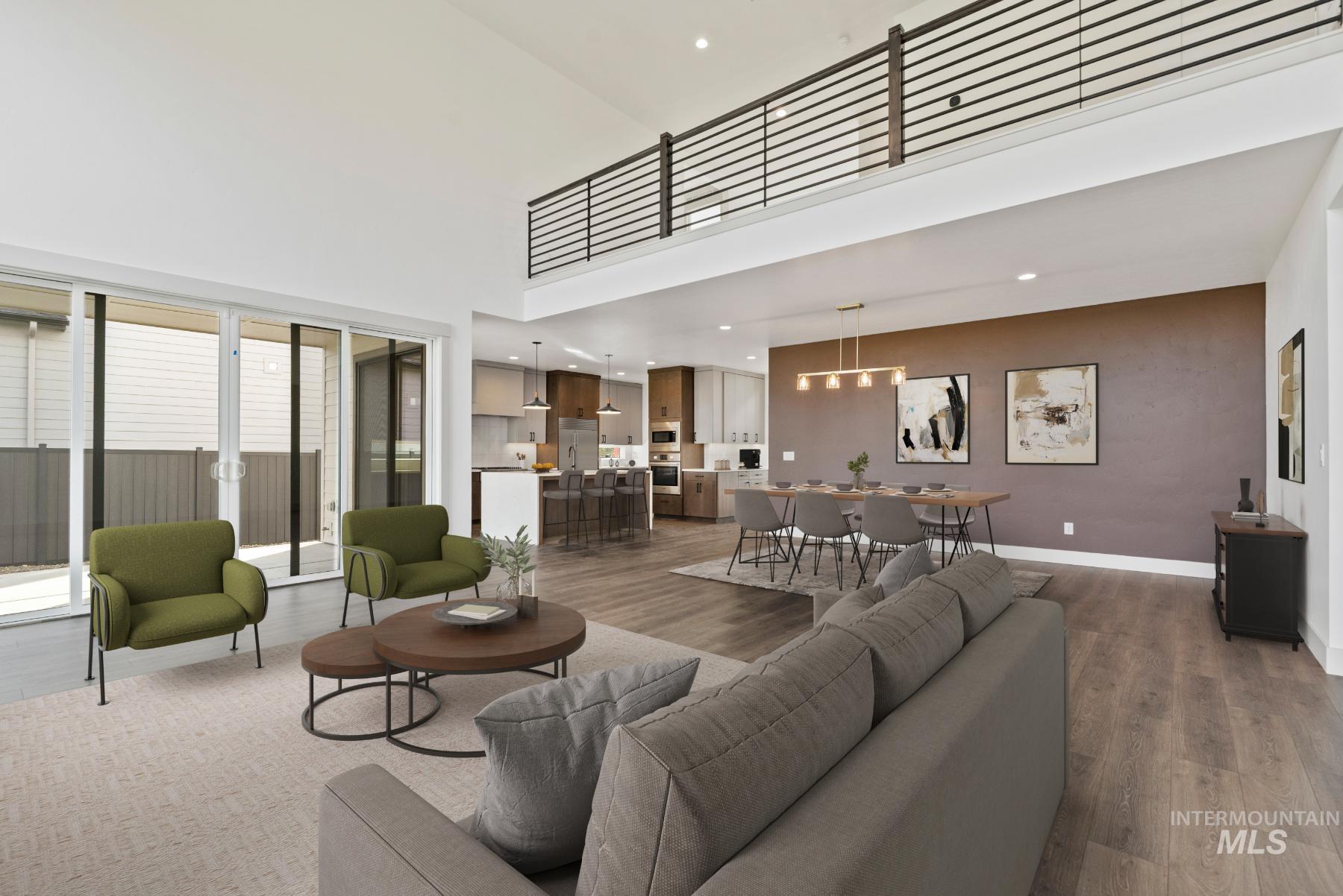 8482 West Graye Street, Unit ALPINE Meridian, ID 83646 - Photo 10 of 19 Living area featuring wood finished floors, a towering ceiling, and recessed lighting