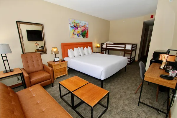 a bedroom with furniture and a bed
