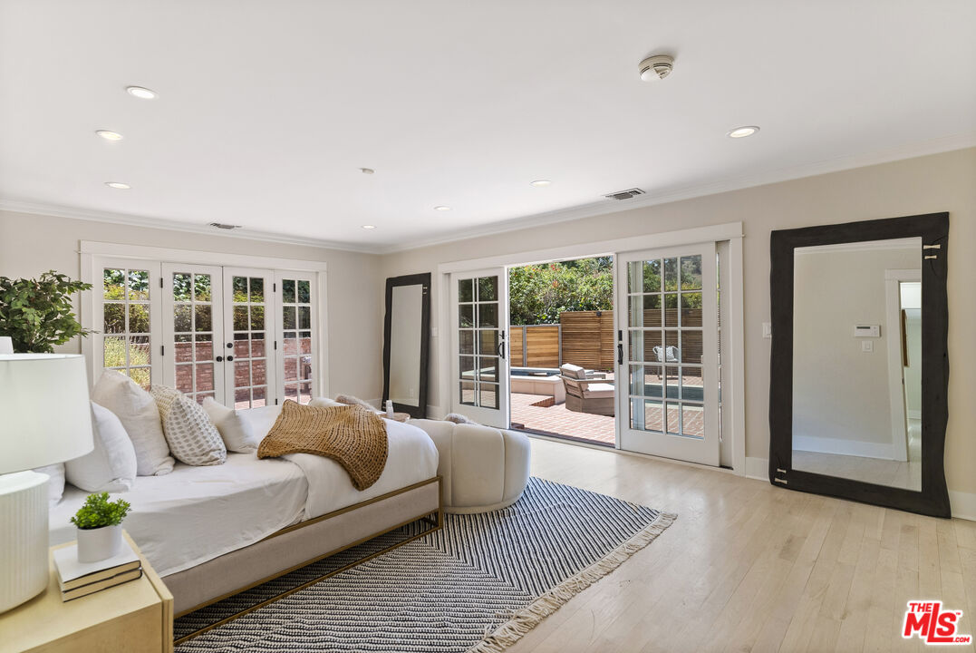 9520 Gloaming Drive Beverly Hills, CA 90210 - Photo 17 of 44 a living room with furniture and a large window