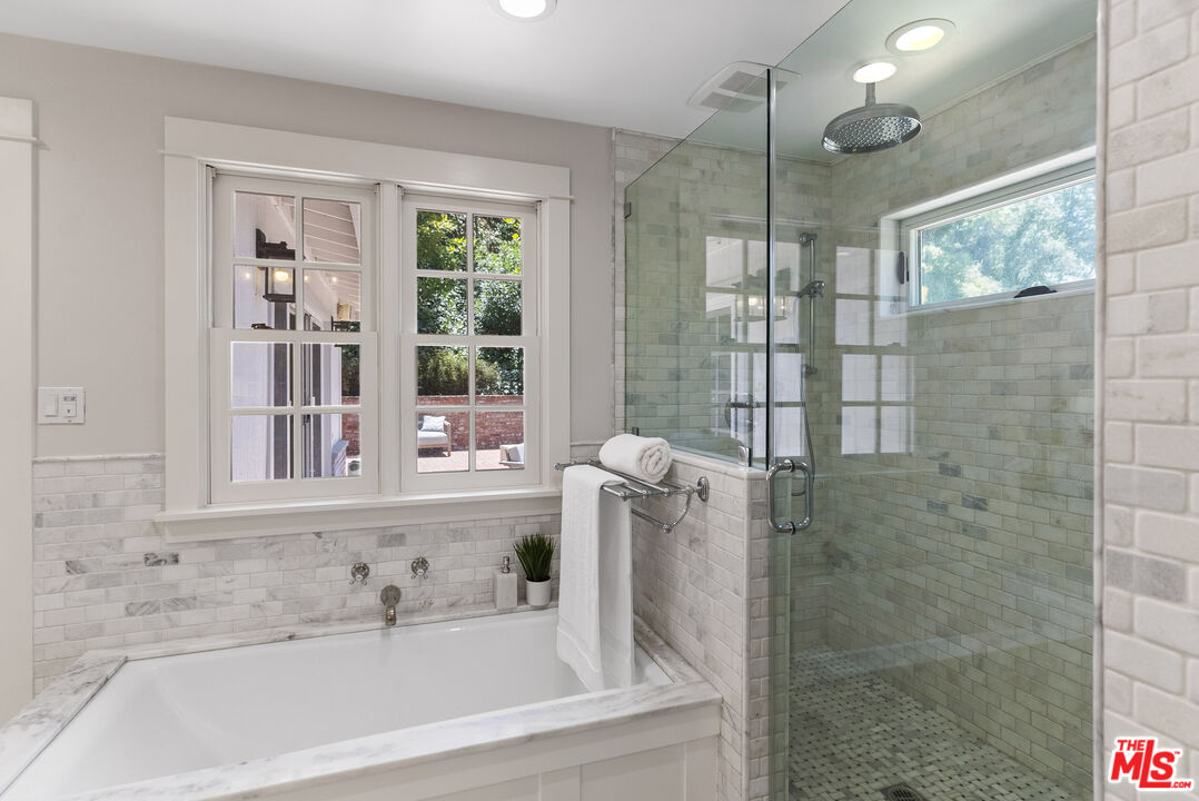 9520 Gloaming Drive Beverly Hills, CA 90210 - Photo 20 of 44 a bathroom with a bathtub and a shower