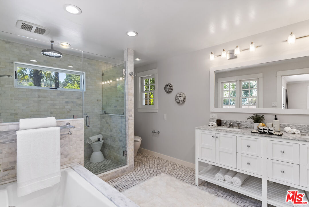 9520 Gloaming Drive Beverly Hills, CA 90210 - Photo 22 of 44 a bathroom with a granite countertop sink mirror and double