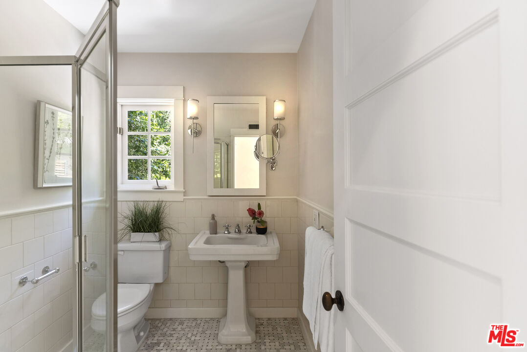 9520 Gloaming Drive Beverly Hills, CA 90210 - Photo 28 of 44 a bathroom with a sink toilet and shower