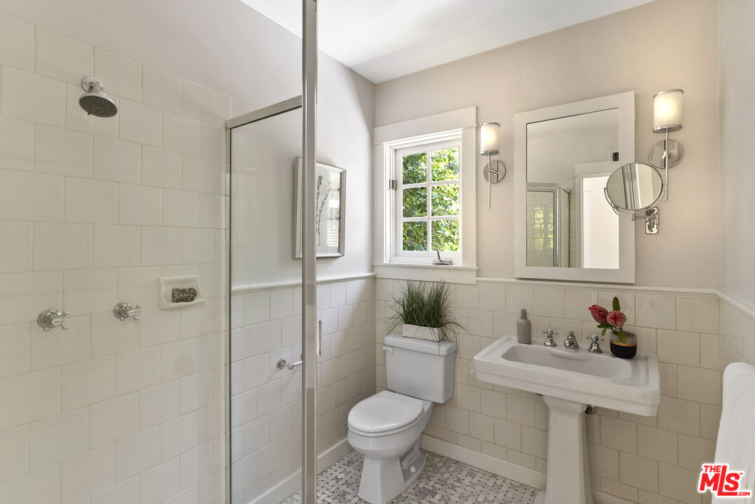 9520 Gloaming Drive Beverly Hills, CA 90210 - Photo 29 of 44 a bathroom with a sink toilet and shower