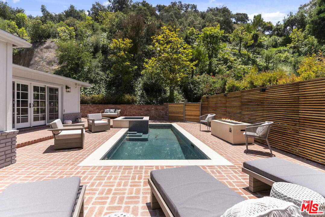9520 Gloaming Drive Beverly Hills, CA 90210 - Photo 34 of 44 a view of swimming pool with lounge chairs