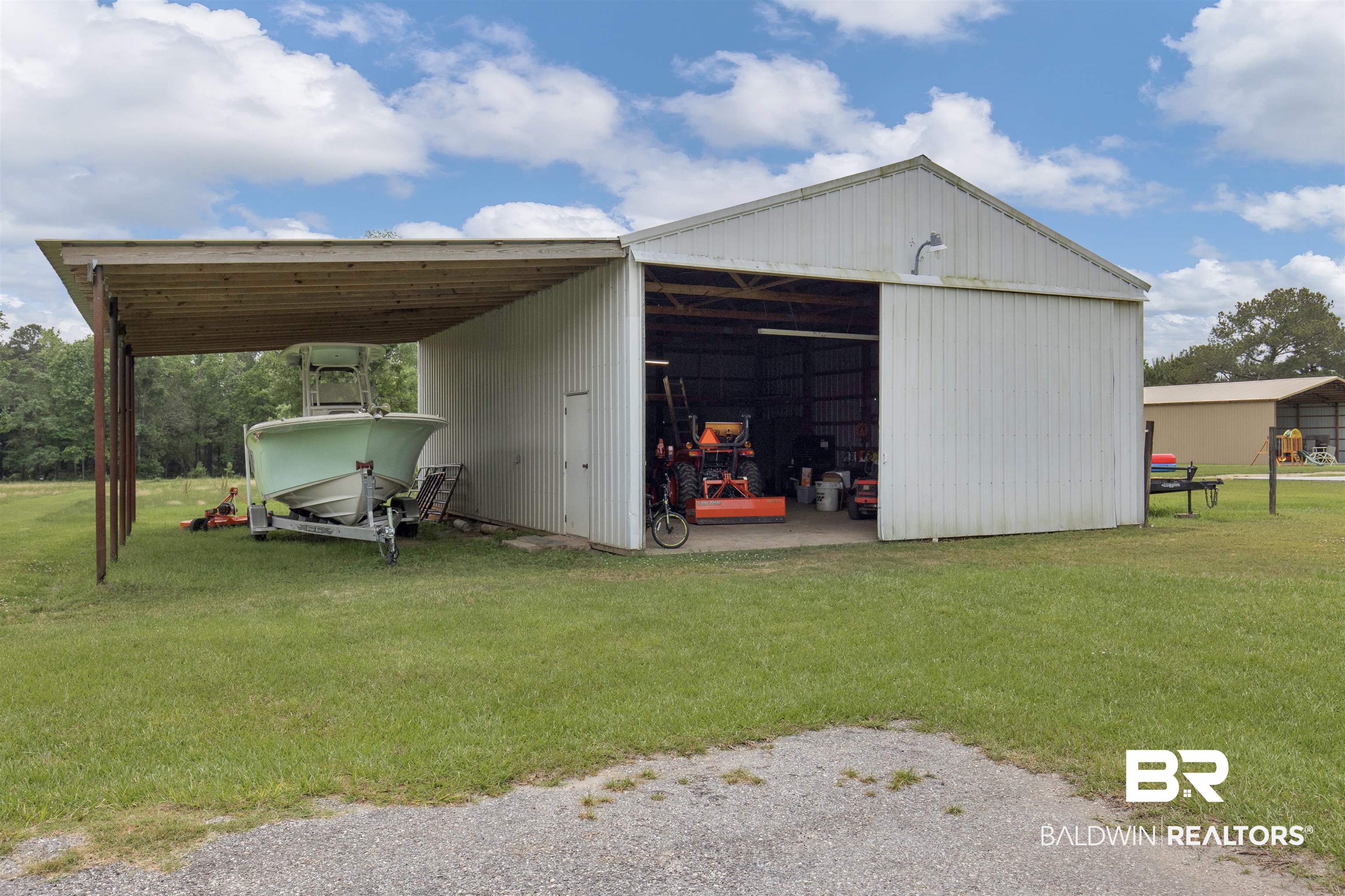 13925 Fort Lake Road Grand Bay, AL 36541 - Photo 20 of 37 View of pole building featuring a yard