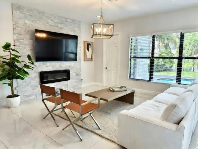 a large bed sitting in a bedroom next to a window