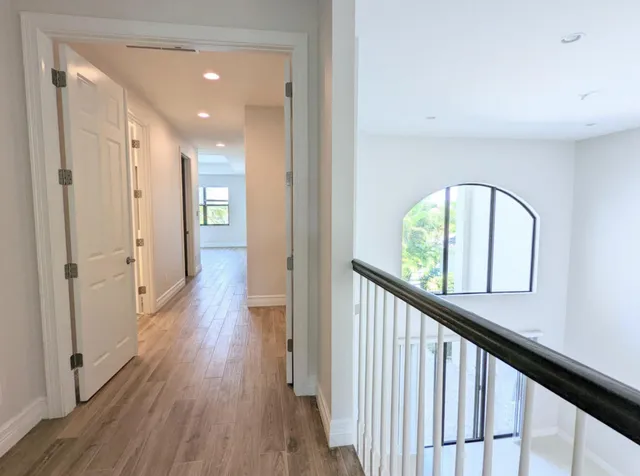 a utility room with cabinets washer and dryer