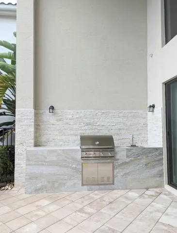 an aerial view of lake and residential houses with outdoor space