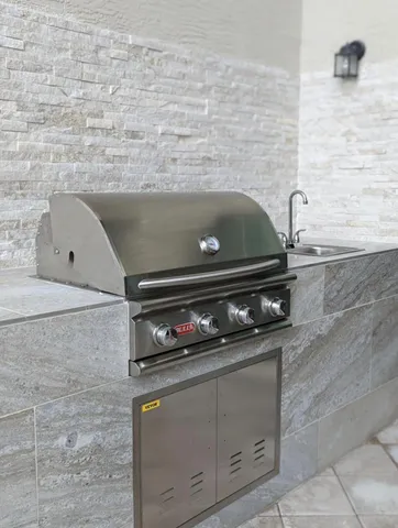an aerial view of a house with a yard and plants