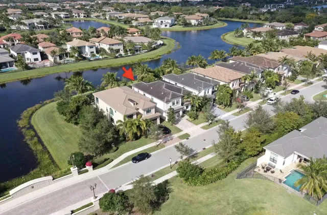 a living room with fireplace furniture and a large window
