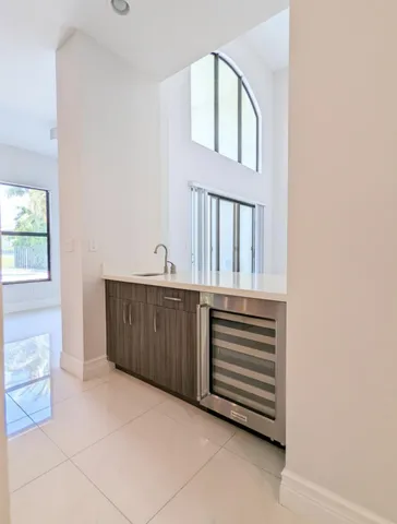 a kitchen with stainless steel appliances a refrigerator and a stove top oven
