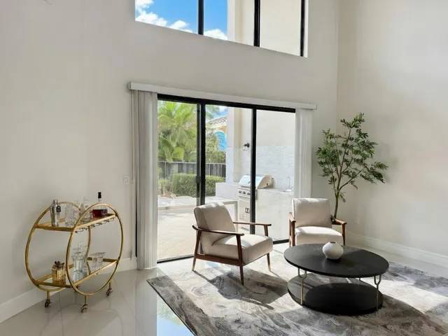 a living room with fireplace furniture and a flat screen tv