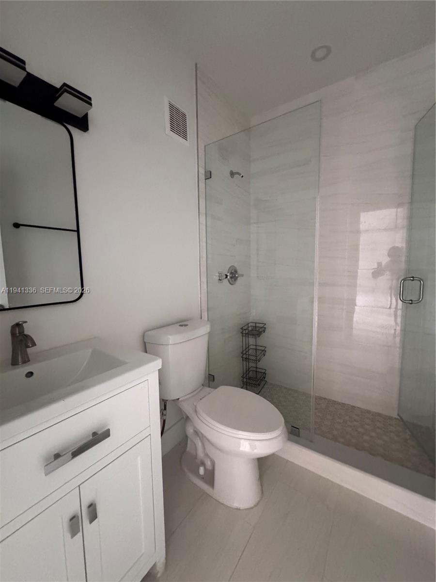 13528 Southwest 9th Lane Miami, FL 33184 - Photo 13 of 26 a bathroom with a sink toilet and shower