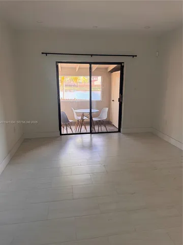 wooden floor in a room with a window