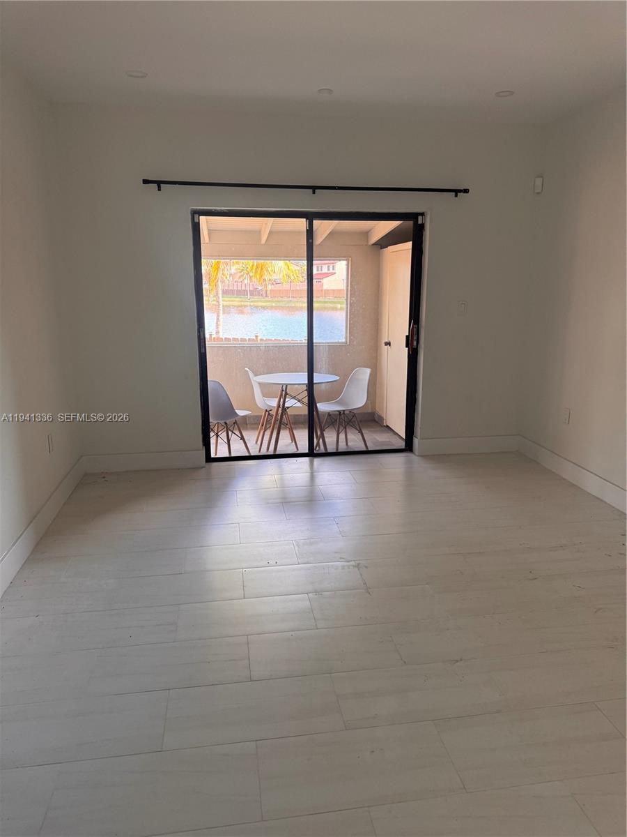 13528 Southwest 9th Lane Miami, FL 33184 - Photo 16 of 26 wooden floor in a room with a window