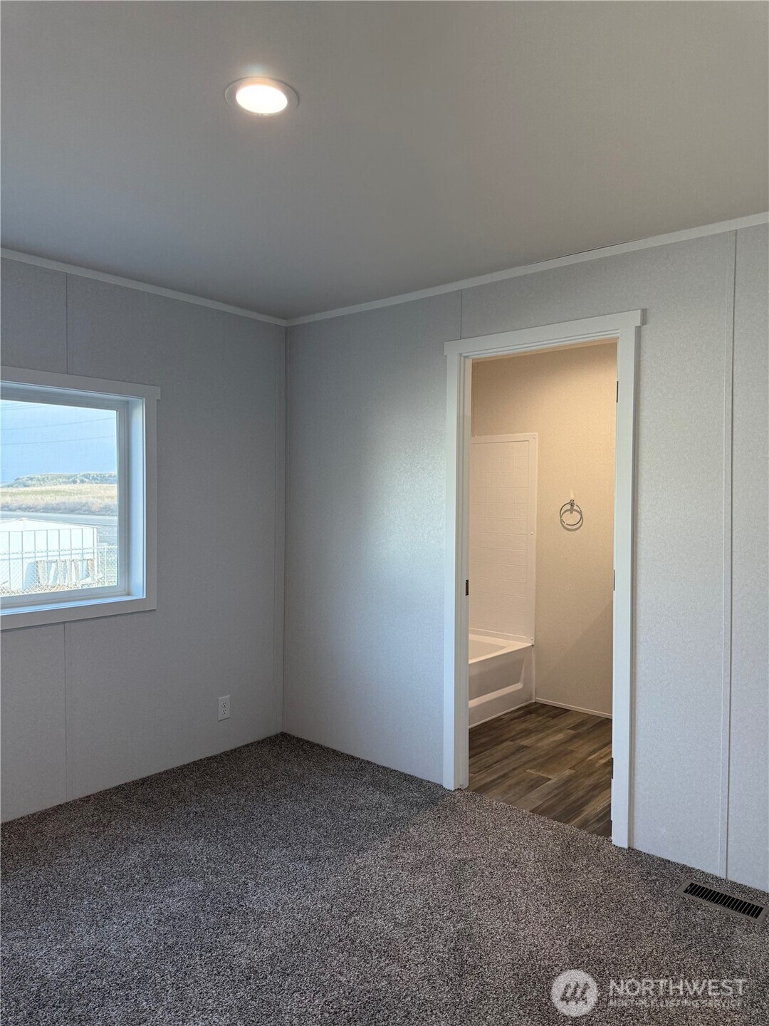 200 West Hawthorn Street, Unit 114 Connell, WA 99326 - Photo 12 of 16 an empty room with a bathroom