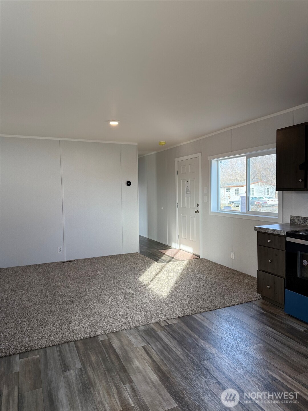 200 West Hawthorn Street, Unit 114 Connell, WA 99326 - Photo 10 of 16 a view of empty room with wooden floor and fan