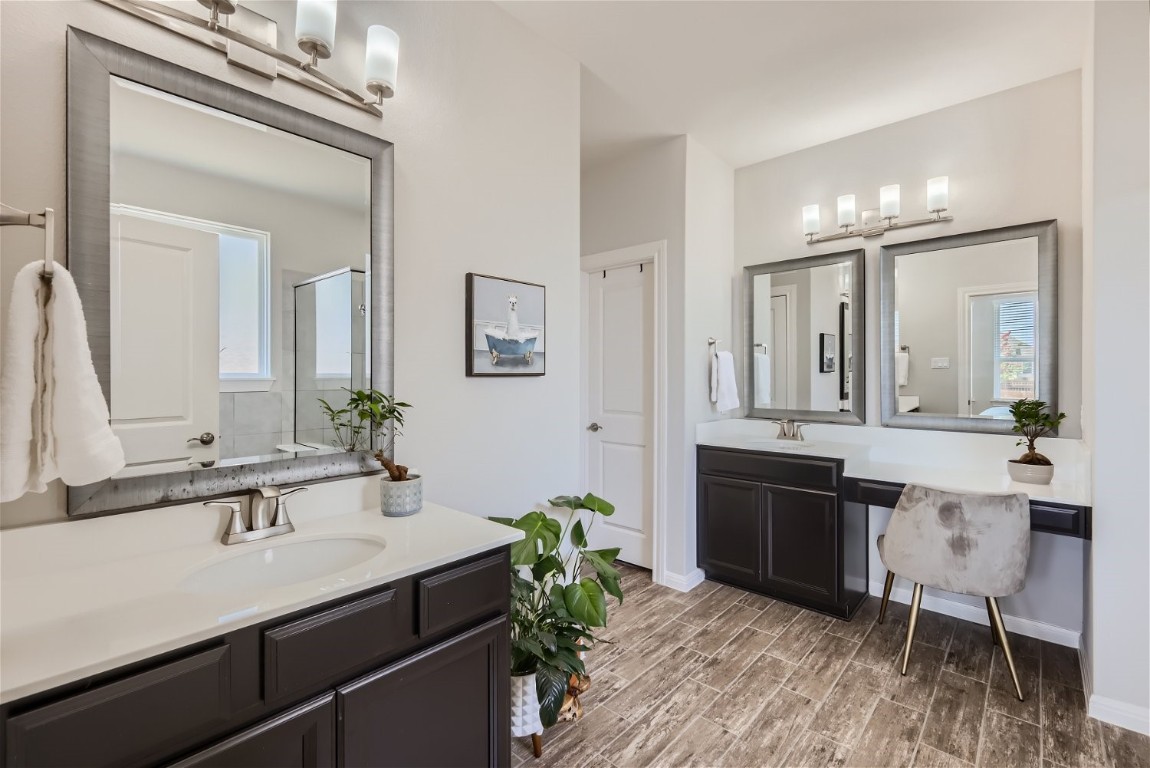 159 Bayberry Circle Buda, TX 78610 - Photo 18 of 29 a bathroom with a sink double vanity and a mirror