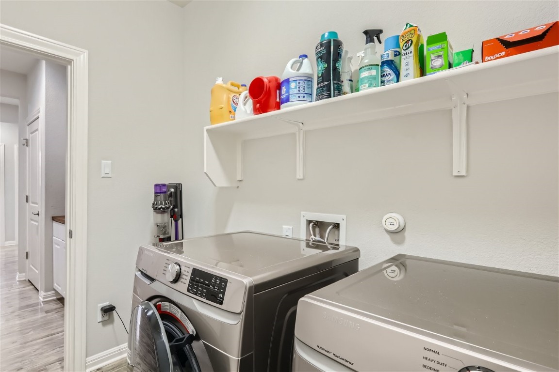 159 Bayberry Circle Buda, TX 78610 - Photo 26 of 29 a utility room with dryer and washer