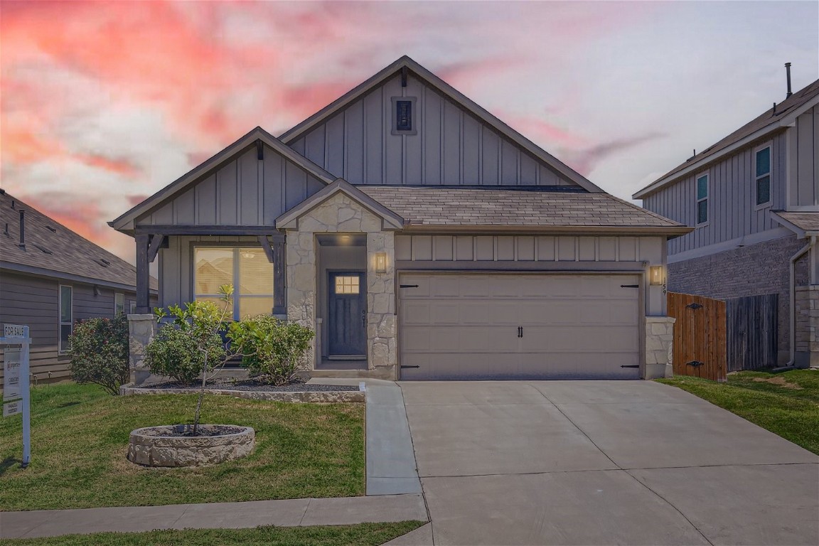 159 Bayberry Circle Buda, TX 78610 - Photo 4 of 29 a front view of a house with garden