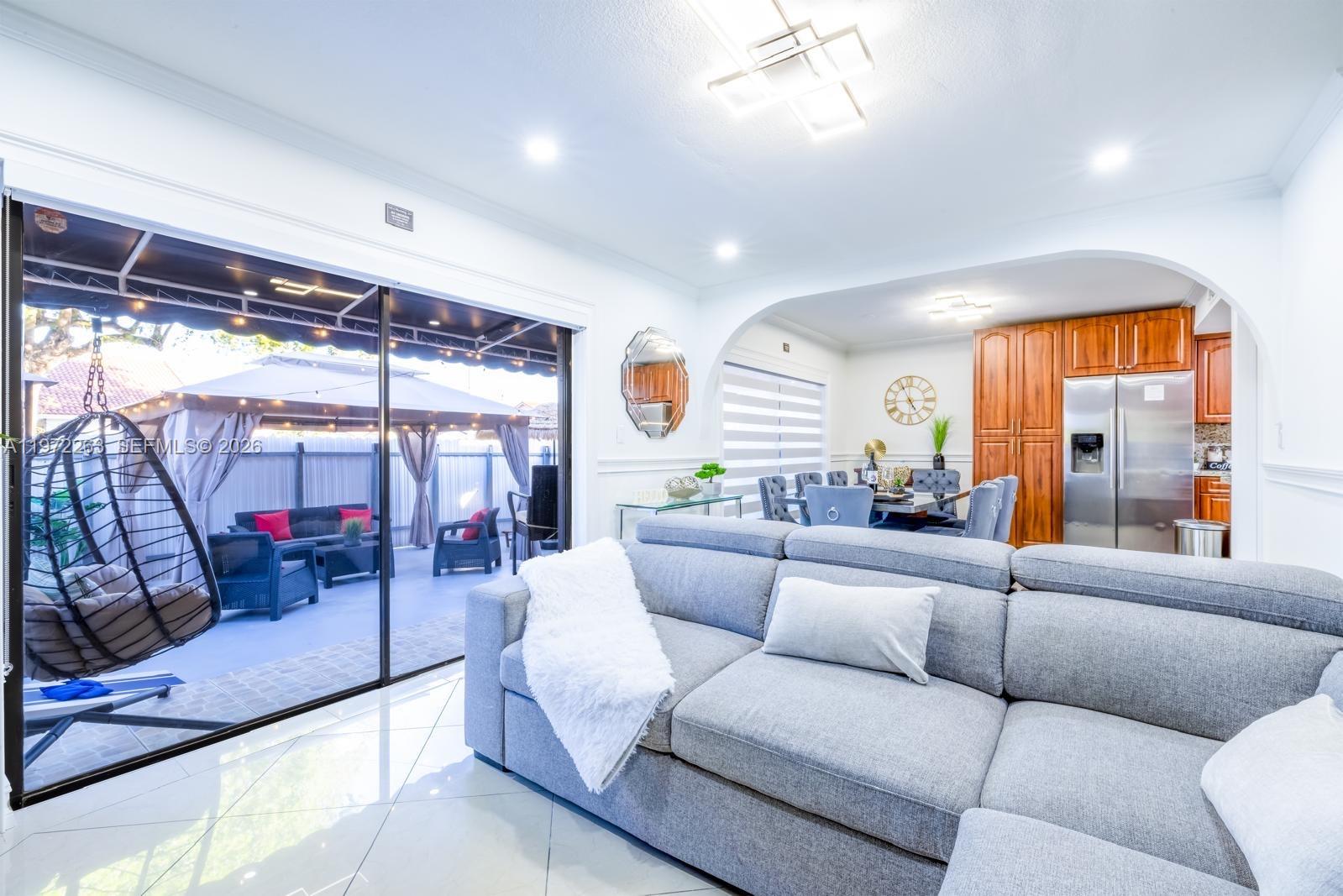 15445 Southwest 57th Street Miami, FL 33193 - Photo 18 of 78 a living room with furniture and a large window