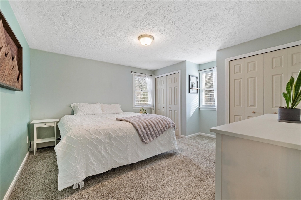 9 Hebert Road Spencer, MA 01562 - Photo 13 of 33 a bedroom with a bed and a window