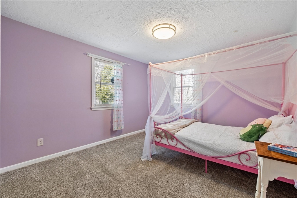 9 Hebert Road Spencer, MA 01562 - Photo 17 of 33 a bedroom with a bed and a window