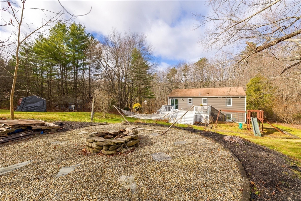 9 Hebert Road Spencer, MA 01562 - Photo 26 of 33 a view of a swimming pool with a patio and a yard