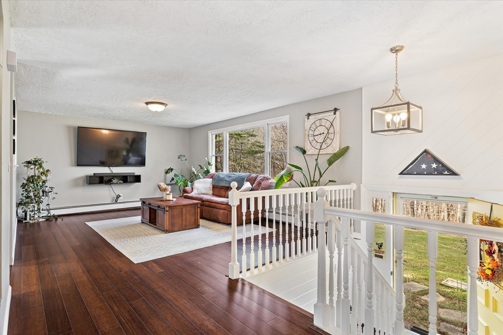 9 Hebert Road Spencer, MA 01562 - Photo 5 of 33 a view of a livingroom with furniture window and wooden floor