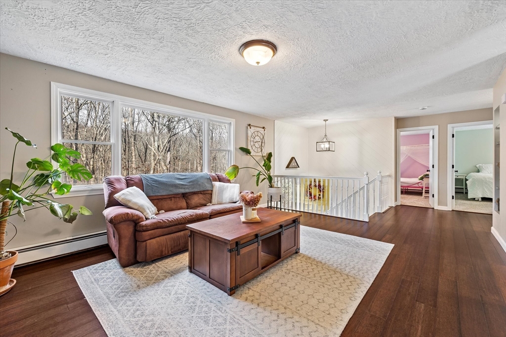 9 Hebert Road Spencer, MA 01562 - Photo 7 of 33 a living room with furniture and a large window