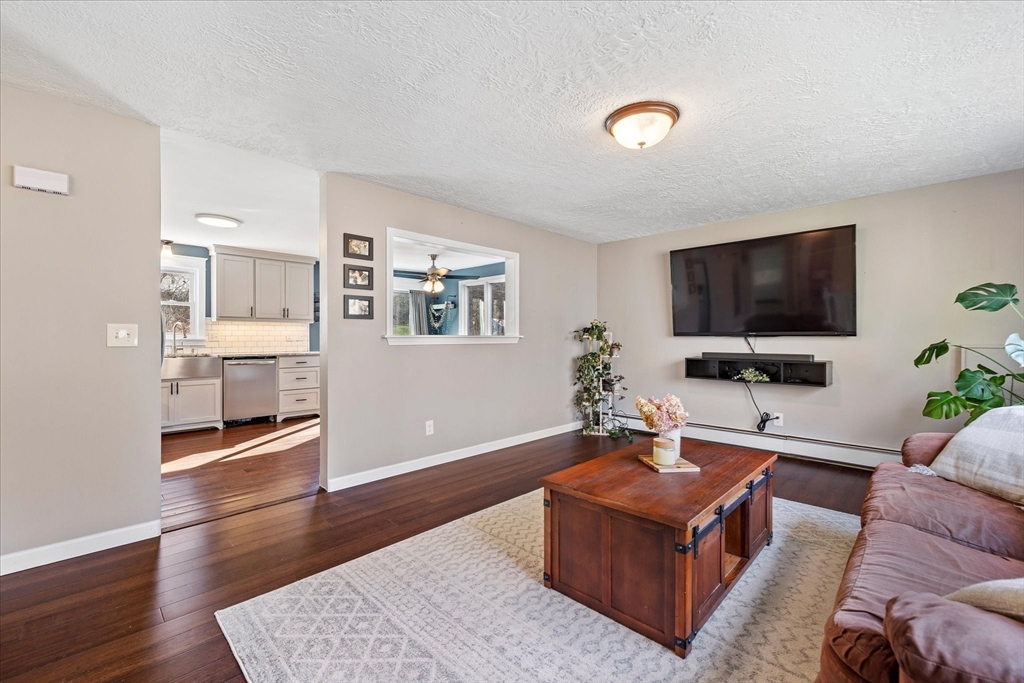 9 Hebert Road Spencer, MA 01562 - Photo 8 of 33 a living room with furniture and a flat screen tv