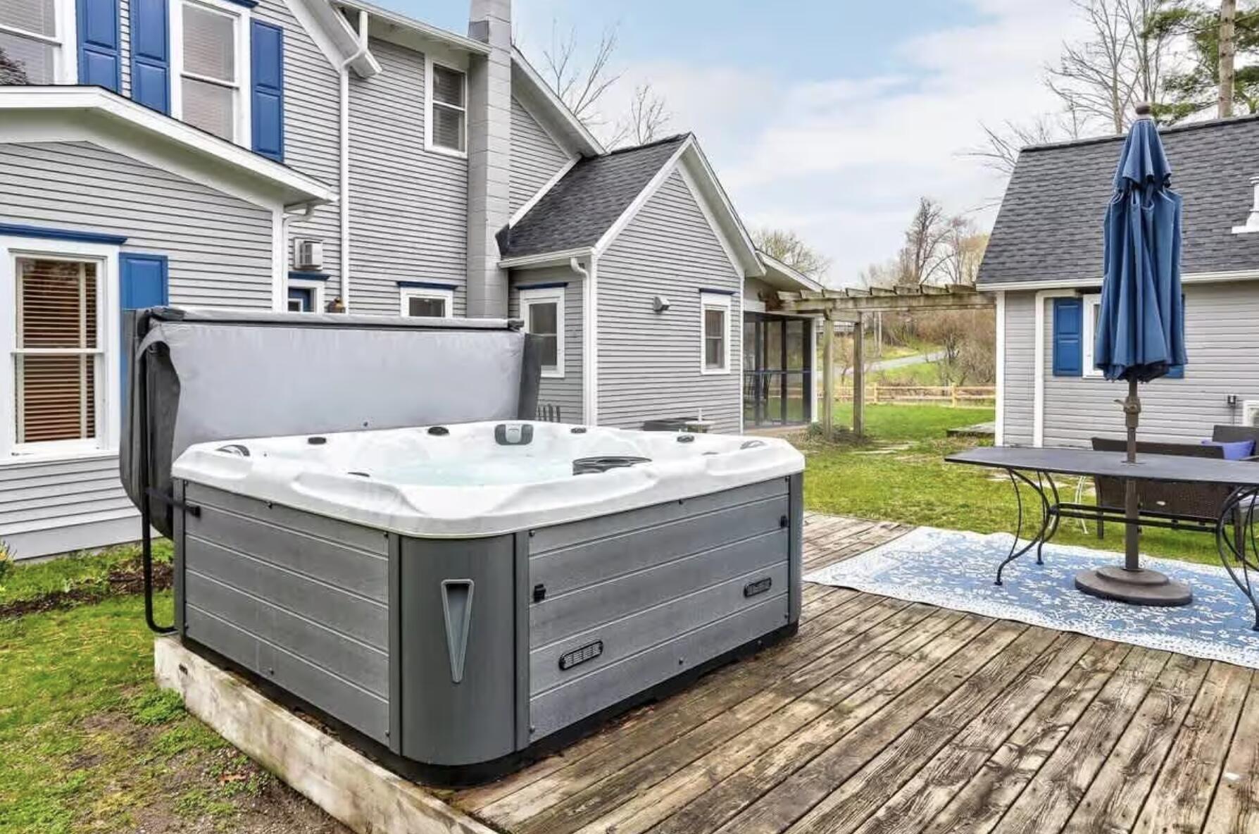 300 Ferry Street Douglas, MI 49406 - Photo 5 of 34 300 Ferry Back yard hot tub