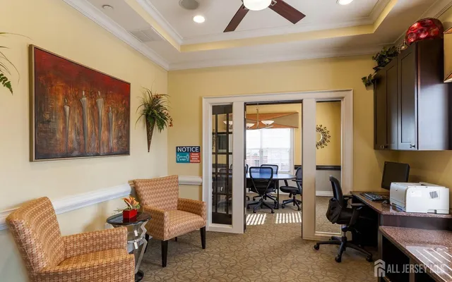 a living room with furniture and a piano