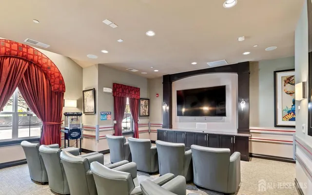 a living room with fireplace furniture and a flat screen tv