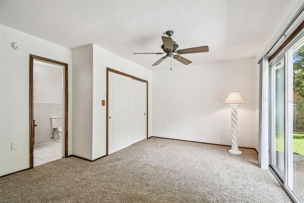 9741 Star Trail New Port Richey, FL 34654 - Photo 17 of 38 an empty room with closet and a ceiling fan