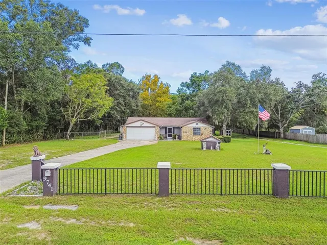 a view of a deck with a big yard