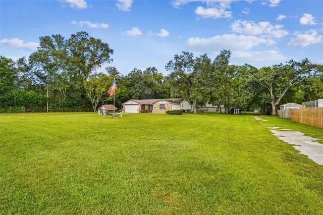 a view of a house with a big yard