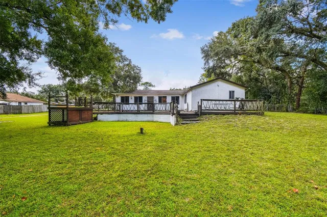 a swimming pool view with a outdoor seating
