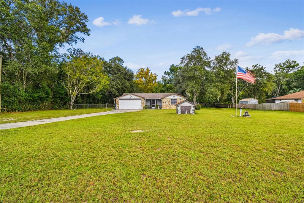 9741 Star Trail New Port Richey, FL 34654 - Photo 2 of 38 a view of a house with a yard